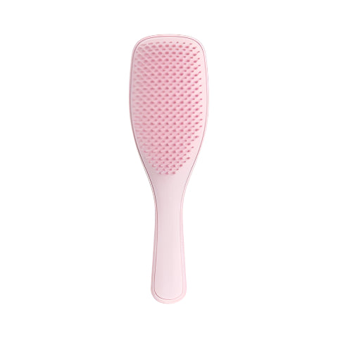Pink tangle teezer paddle brush on a white background