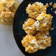 Classic Gluten free Cornflake biscuits on a dark plate